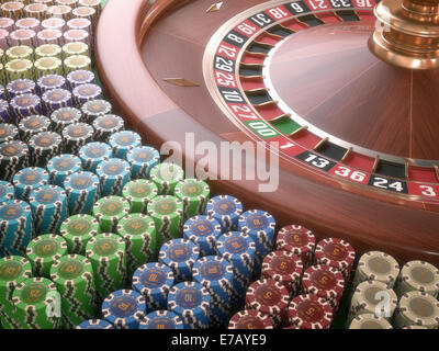 Casino colorato chip disposti intorno alla roulette. Foto Stock