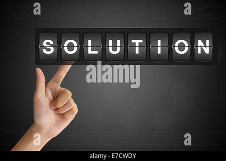 Mano soluzione facendo clic sul Flip Board Display Foto Stock