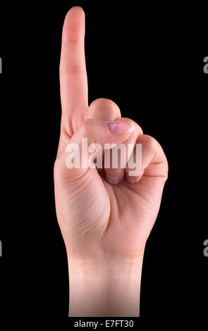 Donna di puntamento a mano su uno sfondo nero Foto Stock