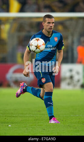 Dortmund, Germania. 16 Sett 2014. Arsenale di Lukas Podolski in azione durante il match di Champions League tra Borussia Dortmund e Arsenal FC a BVB stadium di Dortmund, Germania, il 16 settembre 2014. Credito: dpa picture alliance/Alamy Live News Foto Stock