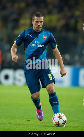 Dortmund, Germania. 16 Sett 2014. Arsenale di Lukas Podolski in azione durante il match di Champions League tra Borussia Dortmund e Arsenal FC a BVB stadium di Dortmund, Germania, il 16 settembre 2014. Credito: dpa picture alliance/Alamy Live News Foto Stock