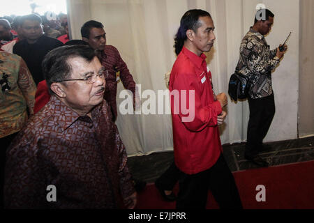 Di Semarang, Indonesia. 19 Settembre, 2014. Il presidente indonesiano eletto Joko Widodo e vice presidente-eletto Jusuf Kalla (L) assistere a frequentare il 4° nazionale riunione di lavoro di PDI-P a Marina Convention Hall di Semarang, Giava centrale, Indonesia. L incontro nazionale a cui hanno partecipato 1.590 quadri del partito da tutta l'Indonesia e si terrà dal 19-21 settembre 2014. La riunione è prevista per cambiare i dieci anni di mentalità del PDI-P, come ha commutato a essendo il partito di essere il partito di opposizione. Credito: PACIFIC PRESS/Alamy Live News Foto Stock