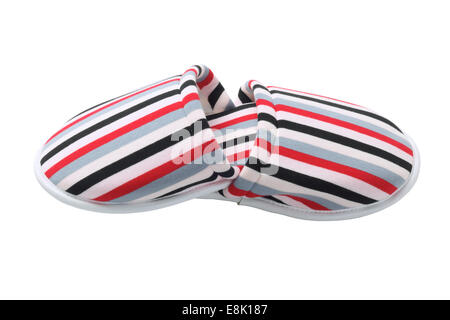 Coppia di strisce colorate Home pantofole su sfondo bianco Foto Stock