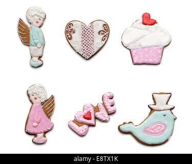 Set di diversi gustosi biscotti su sfondo bianco su il giorno di San Valentino. Uccello, cuore, angeli,torte e biscotti con il testo dell'amore. Foto Stock