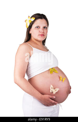 Bella donna incinta con farfalle Foto Stock