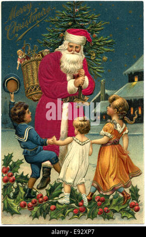 Babbo Natale con tre bambini, 'Buon Natale", cartolina Foto Stock