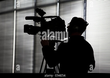 Una telecamera video operatore in occasione di una conferenza tenutasi nel Regno Unito Foto Stock