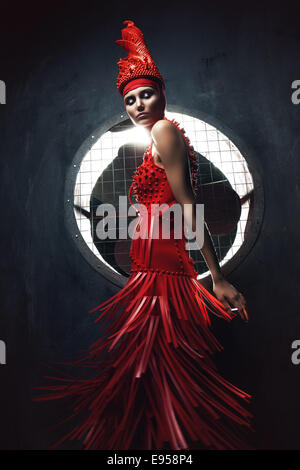 Dynamic woman in red e propeller Foto Stock