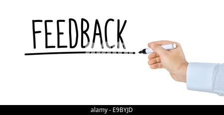 Mano con penna a scrivere la parola Feedback Foto Stock