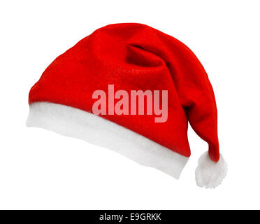 Christmas Santa hat isolata contro uno sfondo bianco inclinato e su un angolo di un grande elemento con bordi lisci per una facile selezionare Foto Stock