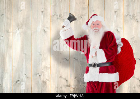 Immagine composita di santa claus campana che squilla Foto Stock