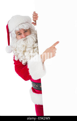 Padre gioioso Natale presentando segno Foto Stock