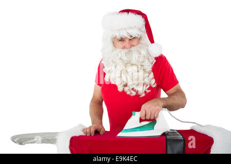 Felice di Babbo Natale di stirare la sua camicia Foto Stock