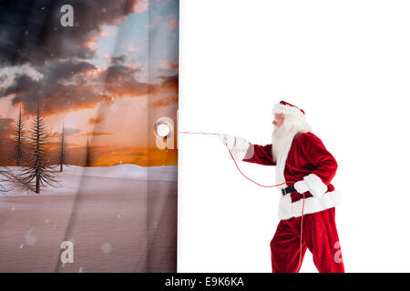 Immagine composita di santa tira qualcosa con una corda Foto Stock