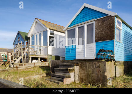 Spiaggia di capanne su Mudeford sputare in testa Hengistbury vicino a Christchurch in Dorset Foto Stock