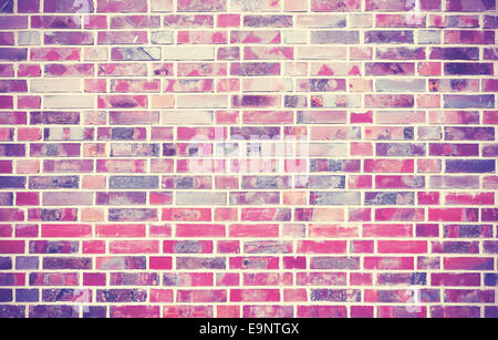 Grunge muro di mattoni con uno sfondo con angoli vignettato. Foto Stock