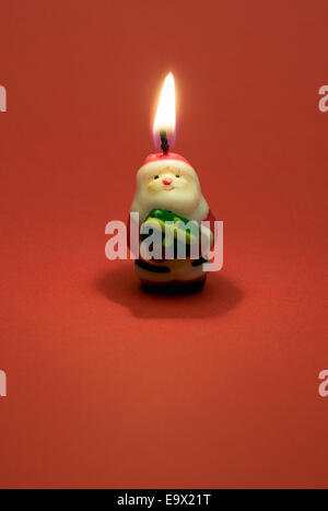 La masterizzazione di santa claus candela Foto Stock