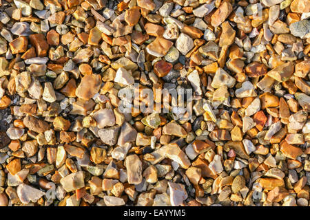 Golden Colored Stone trucioli per lo sfondo Foto Stock