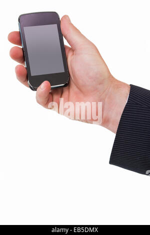 La mano di un imprenditore tenendo il telefono cellulare Foto Stock
