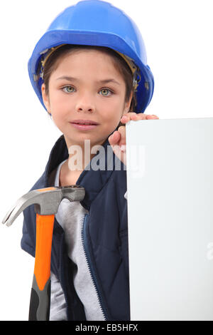 Bambina vestito come operaio edile Foto Stock