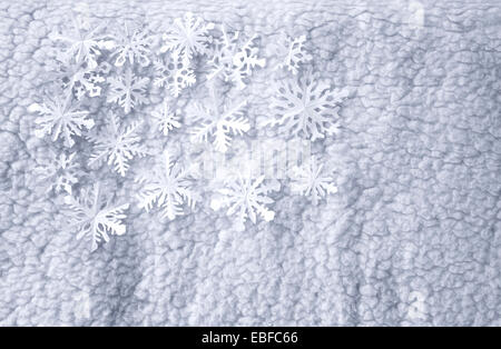White paper di fiocchi di neve sul luminoso sullo sfondo di lana Foto Stock
