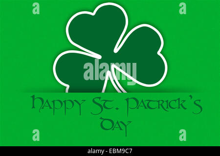 Vacanza irlandese il giorno di San Patrizio nel verde sullo sfondo di saluto con trifoglio e testo - felice per il giorno di San Patrizio Foto Stock