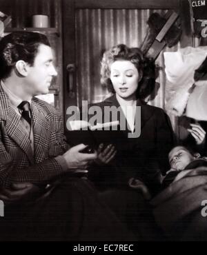 La signora Miniver è un 1942 American film drammatico diretto da William Wyler e interpretato da Greer Garson e Walter Pidgeon. Sulla base del 1940 romanzo Signora Miniver da Jan Struther, il film mostra come la vita di una modesta casalinga britannico in Inghilterra rurale è toccato dalla Seconda Guerra Mondiale. Foto Stock