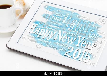 Felice Anno Nuovo 2015 - word cloud su una tavoletta digitale con una tazza di caffè Foto Stock