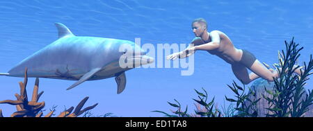 Uomo di nuoto sott'acqua nella parte anteriore di un delfino nell'oceano Foto Stock