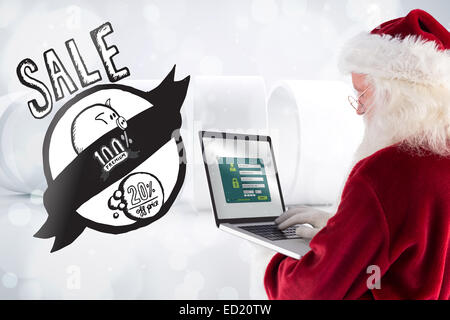 Immagine composita di santa claus utilizza un laptop Foto Stock