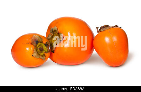 Tre Persimmons intero isolato su sfondo bianco Foto Stock