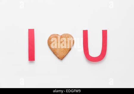 "Ti amo' fatta di carta tagliata e un focolare forma cookie Foto Stock