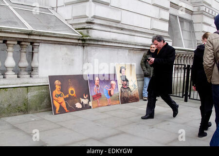Westminster London,UK. Il 7 gennaio 2015. Satirico di dipinti esposti da artista Kaya Mar dell incontro tra Angela Merkel a Downing Street London Credit: amer ghazzal/Alamy Live News Foto Stock