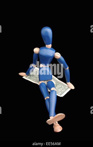 Femmina manichino seduto di fronte dollaro, USD Foto Stock