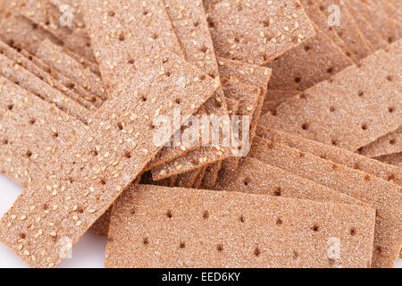 Pila di crackers con semi di sesamo foto in primo piano. Foto Stock