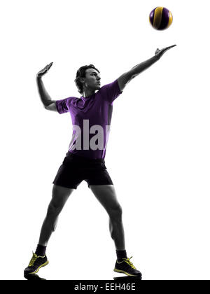 Young volley ball player uomo in silhouette sullo sfondo bianco Foto Stock