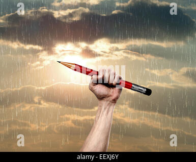 Mano con matita, come un simbolo di attacco terroristico in Francia Foto Stock