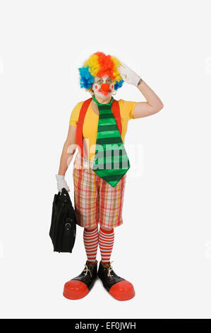 Persona che indossa un costume da clown Foto Stock