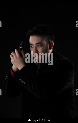 Pizzetto Man in Black Suit Arma di contenimento Foto Stock
