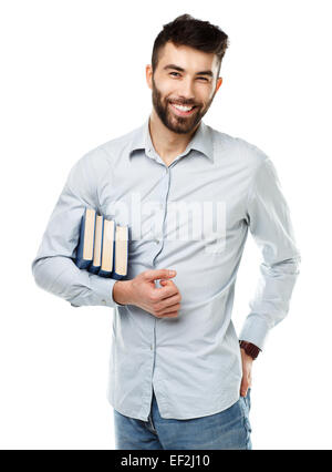 Giovani barbuto uomo sorridente con libri in mano su sfondo bianco Foto Stock