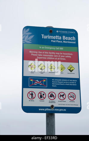 Turimetta Beach,Warriewood. parte di testa Narrabeen riserva acquatica.segno indicante i pericoli. Foto Stock