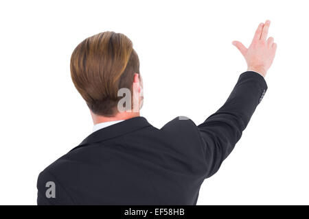 Vista posteriore di imprenditore puntando con le sue dita Foto Stock