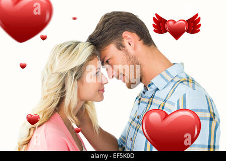 Immagine composita della coppia attraente sorridente ad ogni altro Foto Stock