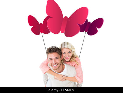 Immagine composita di uomo bello dando piggy back alla sua ragazza Foto Stock