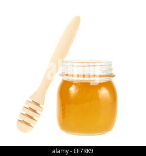 Il miele il bilanciere accanto a un vaso Foto Stock