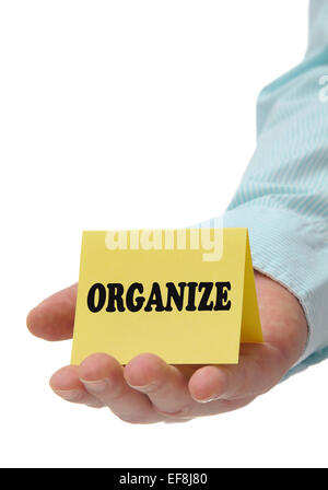 Business man holding organizzare segno a portata di mano Foto Stock