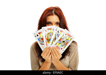 Bella bruna con martinetti a Poker in mani Foto Stock