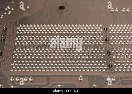 Scheda di circuito texture e i pin sulla scheda madre del computer Foto Stock
