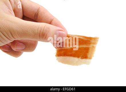 Uomo con una mano per il taglio di prosciutto Serrano slice isolati su sfondo bianco. Jabugo. Le tapas spagnole Foto Stock