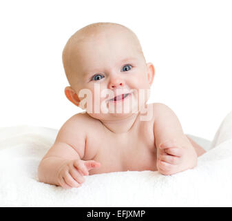 Carino sorridente baby kid giacente Foto Stock